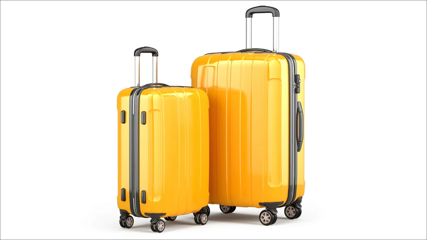 Ein kleiner und ein großer Reisekoffer, beide in gelb.